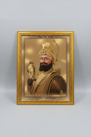 A framed portrait print of Sri Guru Gobind Singh JI