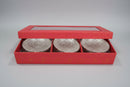 Three German Silver bowls in a red box with a blurred background
