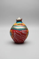 A small hand-painted wooden money box with a spout and coin slot, Baby Bank , Gulak