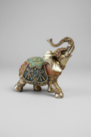 Decorative elephant figurine with intricate designs on a black background