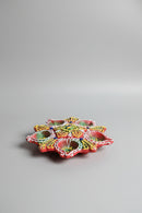 A colorful, hand-painted clay diya (oil lamp) 