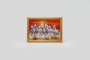 A framed wall art print depicting seven white horses galloping across a desert landscape at sunset.