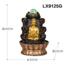 A decorative Buddha fountain sculpture shown on a white background with dimension labels indicating height 30CM, width 20CM, and length 20CM. The product features a seated gold Buddha figure in the center, dark brown leaf-like tiers with water flowing into a lotus-shaped base, and a small green glowing orb at the top.